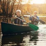 Old couple rowing