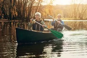 Old couple rowing