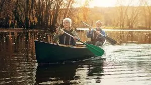 Old couple rowing