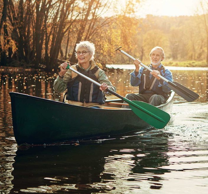 Old couple rowing