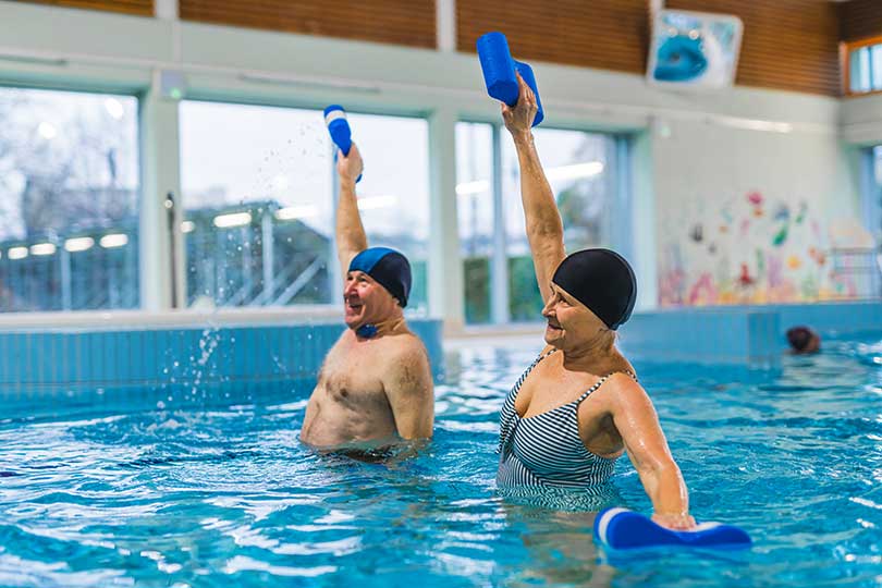 senior doing aqua fitness exercises